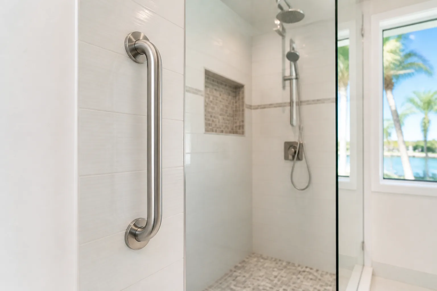 Grab bar and bathroom towel bar installation on tile in a Miami bathroom