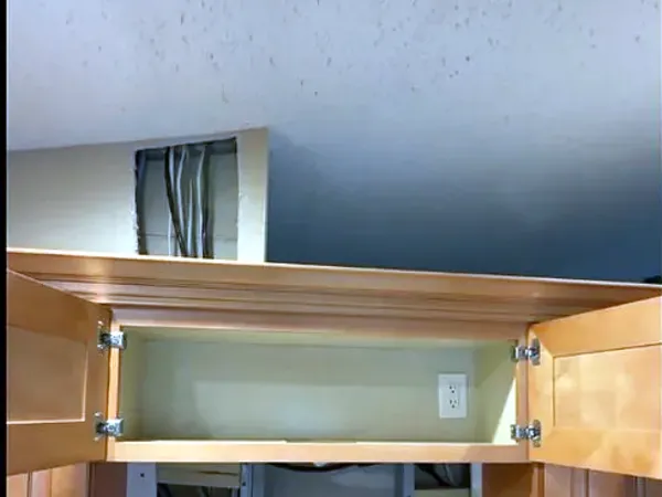 Before: open space between kitchen cabinets