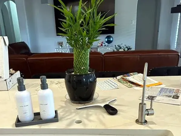Before: old kitchen faucet on an island sink