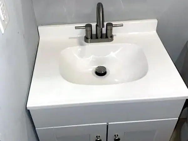 After: the vanity installed with its faucet